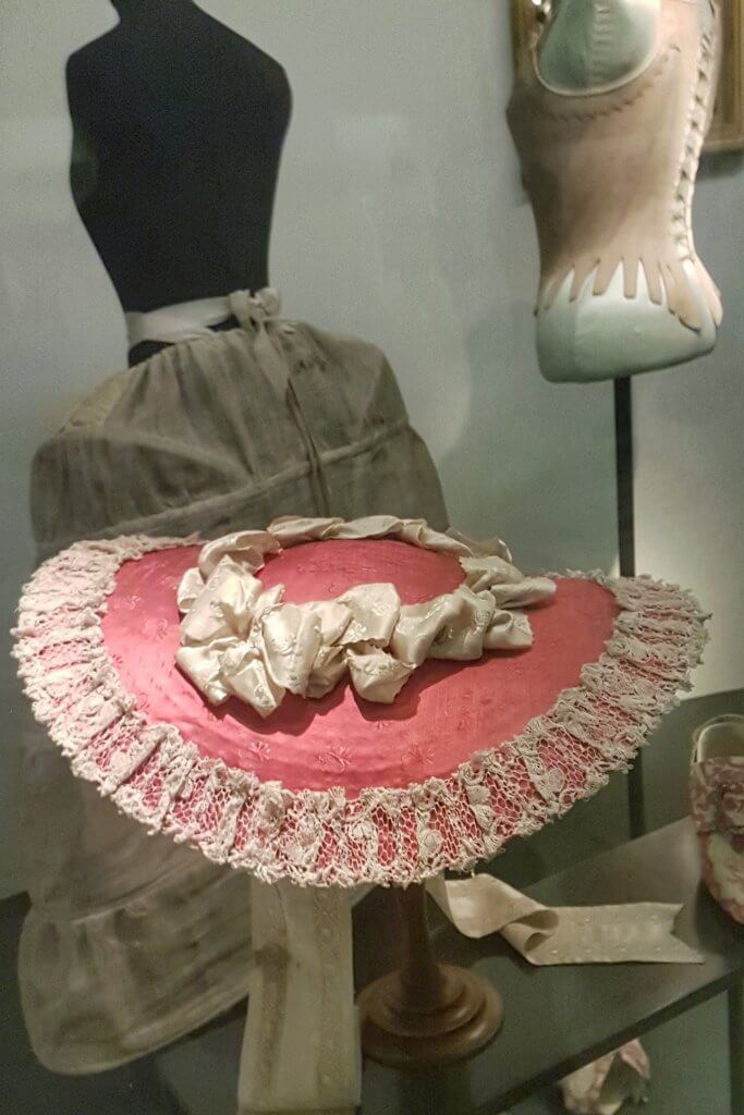 pink and white hat at the Victoria and Albert