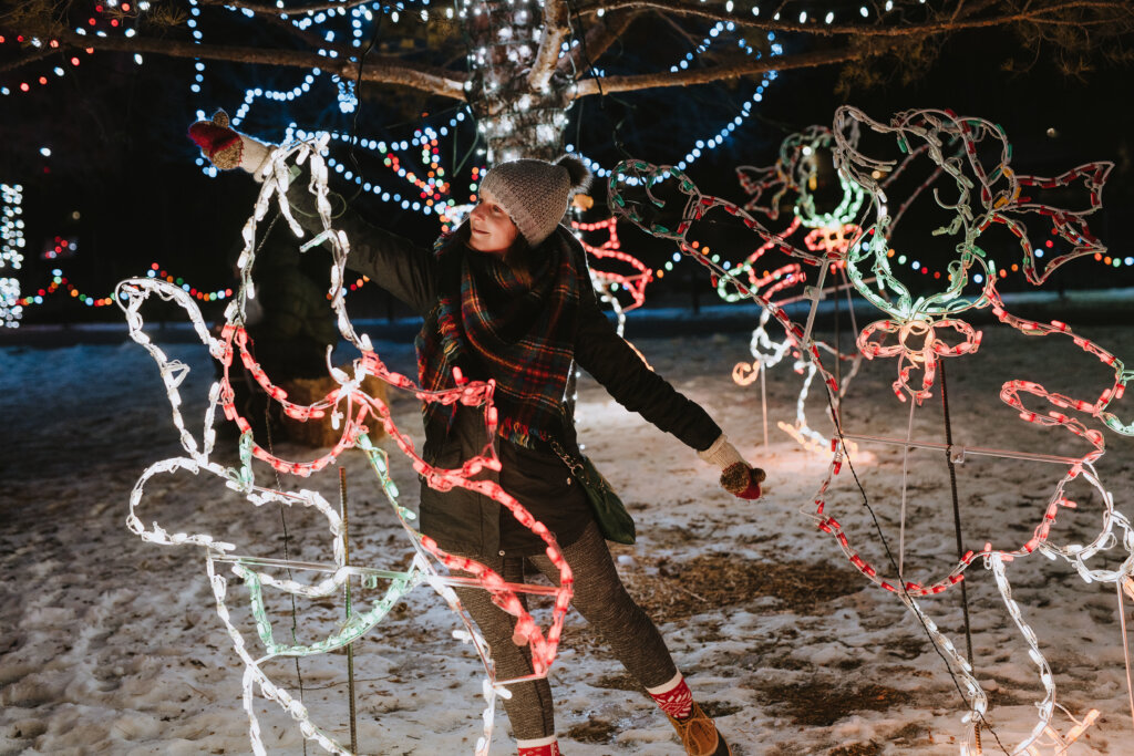 Woman posed with polar bear Christmas lights