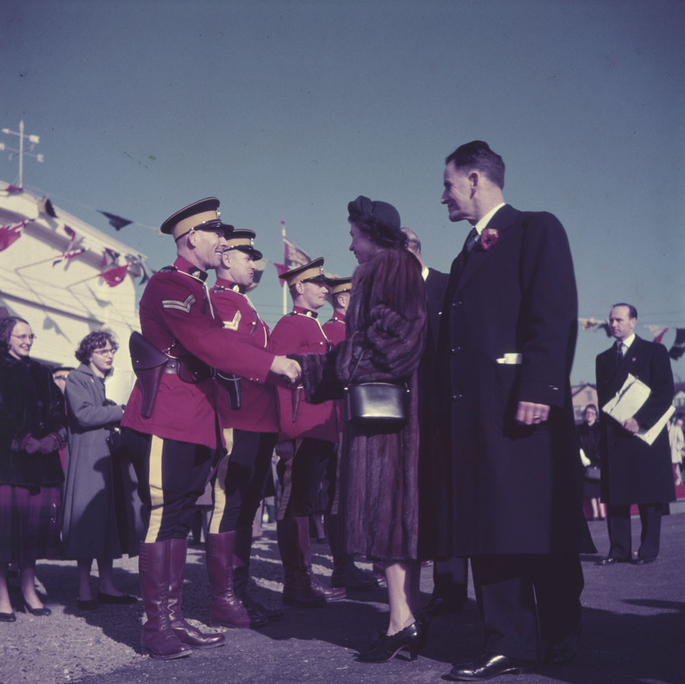 Queen Elizabeth and Prince Philip being greeted by the RCMP