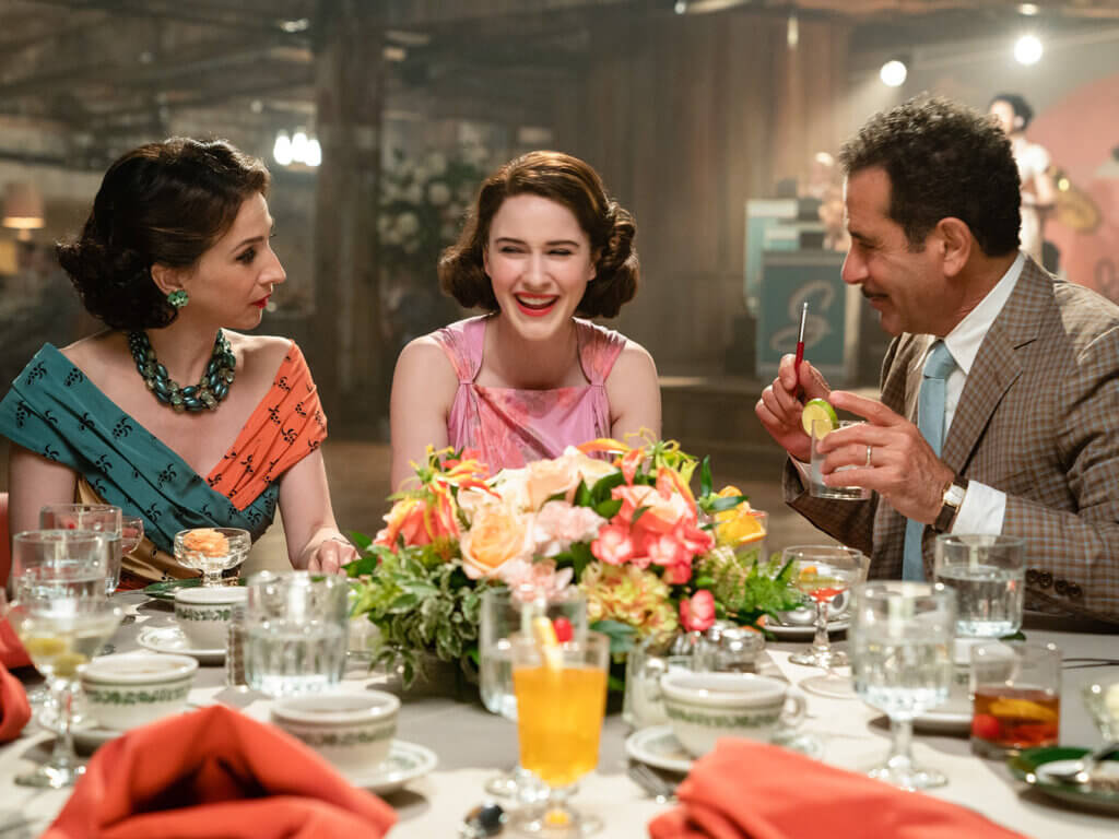 Rose Weismann, Midge Maisel, and Abe Weismann at dinner