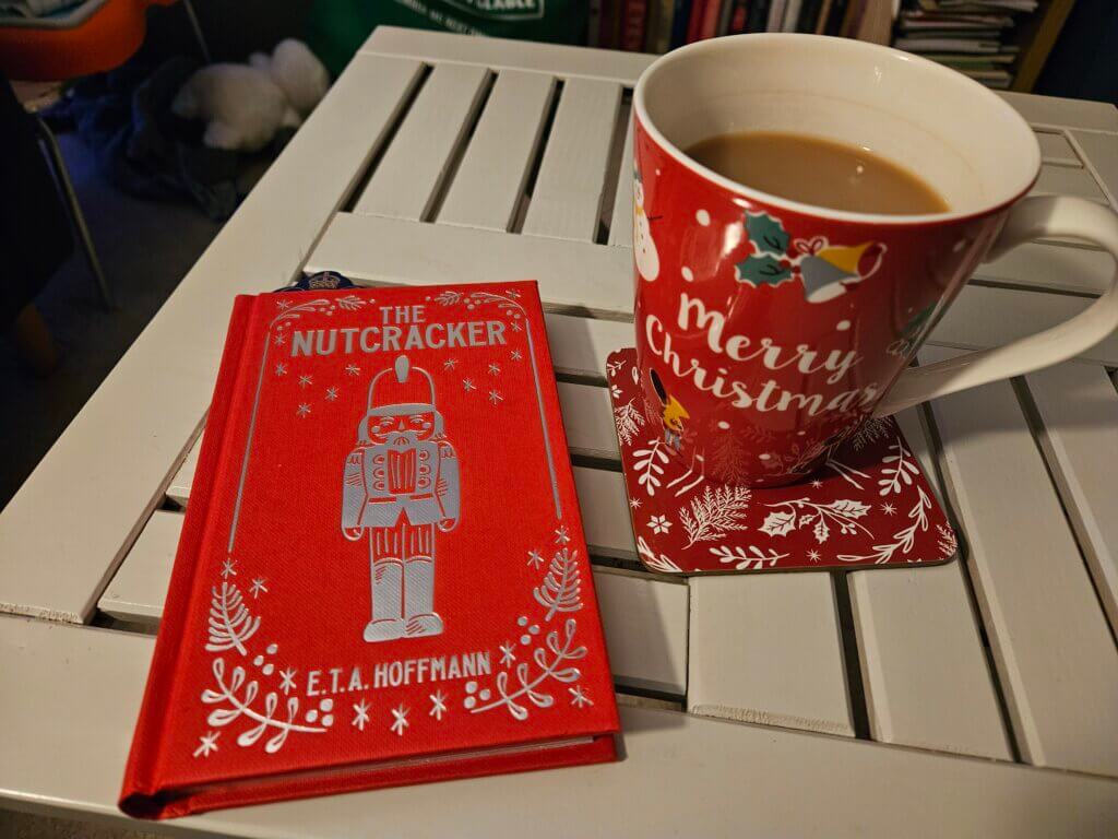 The Nutcracker book and a cup of tea